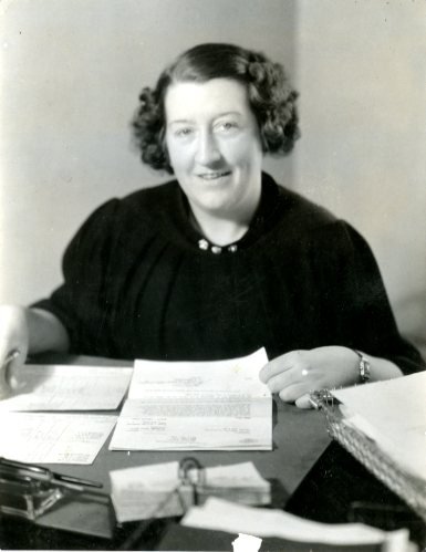 Helen Whalen poses with some letters