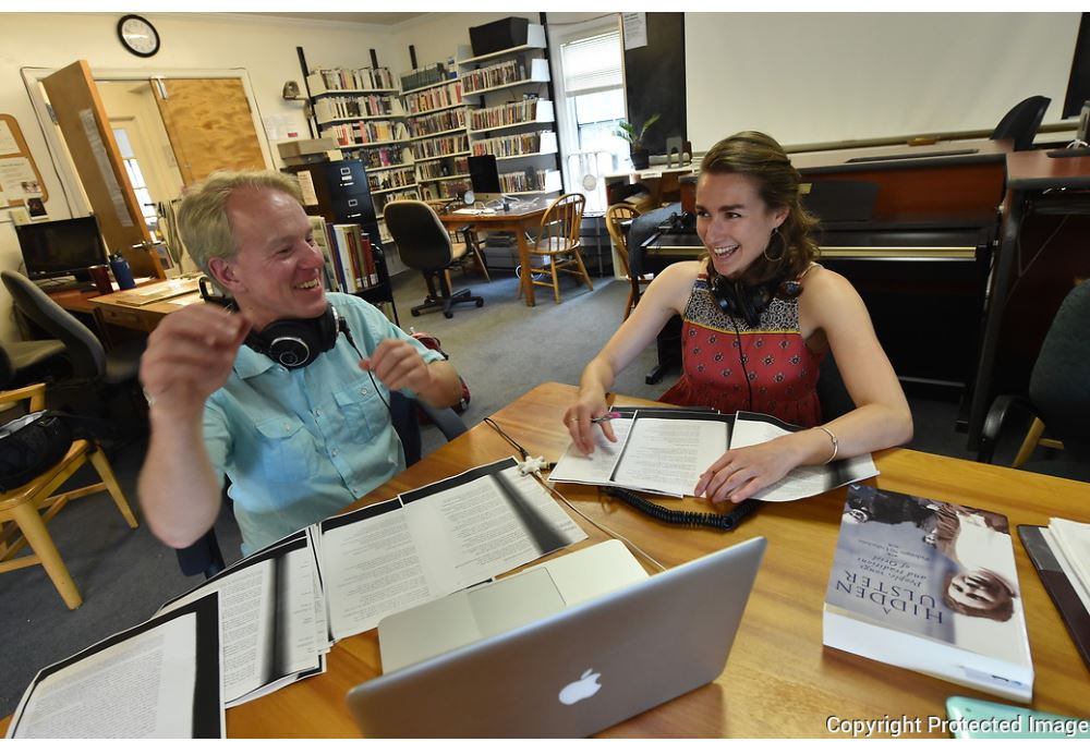 professor and student in a music library