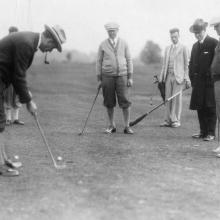 Owen Young enjoying a round of golf on the new SLU course in 1926.