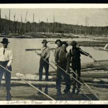 A young Watson Berry working as a logger.