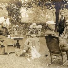 Photograph of the Sudds family in the yard of their home in Chippewa Bay, New York.