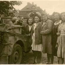 Joseph Doboze pictured with several women after the liberation of France, 1944.