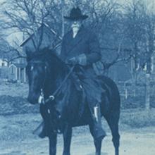 Henry D. Payne on horseback.